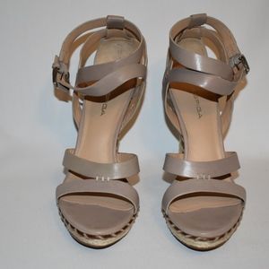 Tan leather crossover platform sandals.